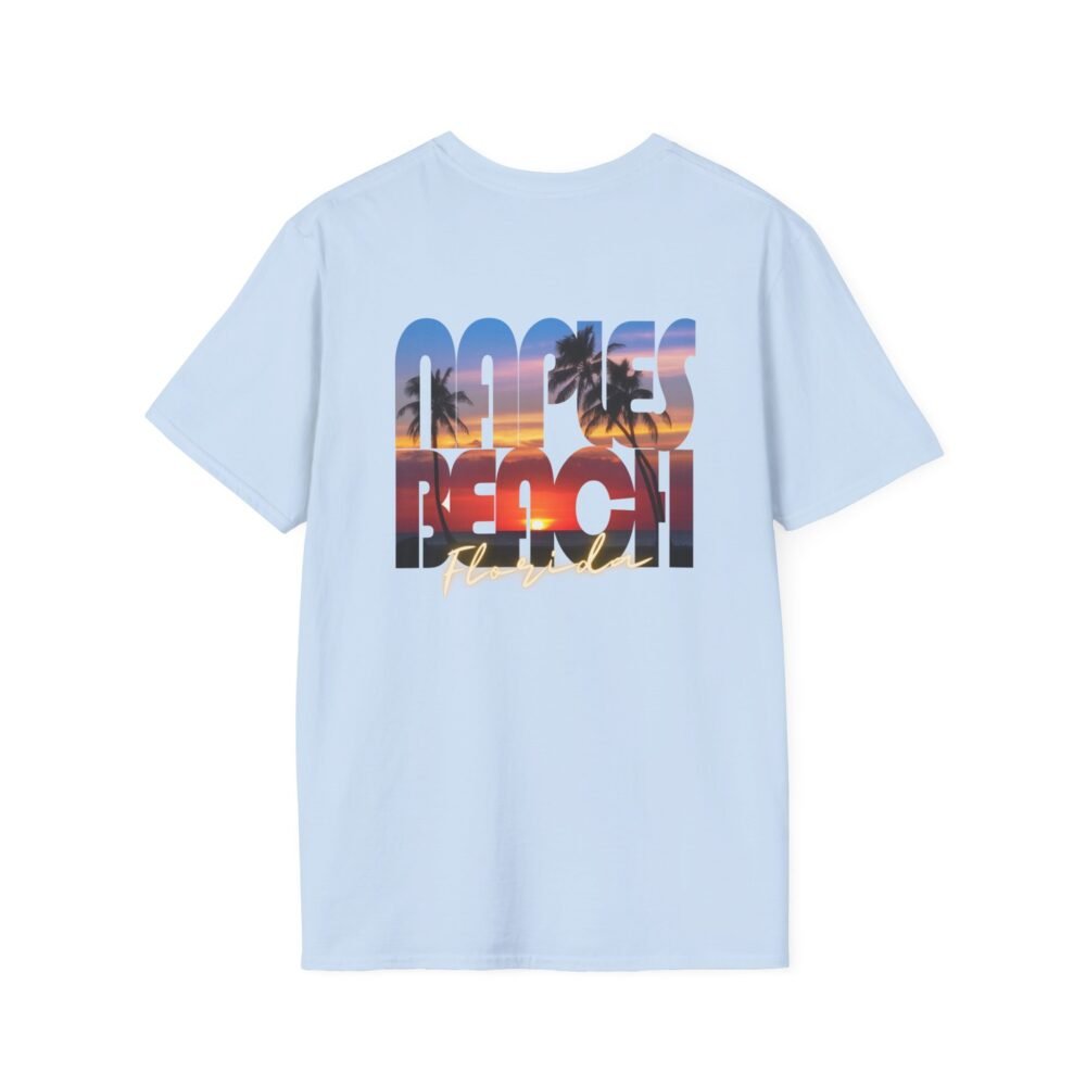 Light blue t-shirt with a large graphic on the back that says "NAPLES BEACH" in distressed, block letters. The letters are filled with a vibrant sunset image featuring silhouetted palm trees and a colorful sky reflecting on water, with "FLORIDA" written in script underneath.