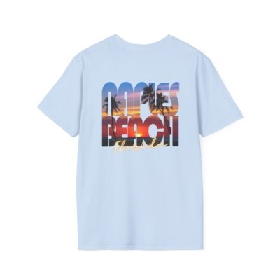 Light blue t-shirt with a large graphic on the back that says "NAPLES BEACH" in distressed, block letters. The letters are filled with a vibrant sunset image featuring silhouetted palm trees and a colorful sky reflecting on water, with "FLORIDA" written in script underneath.