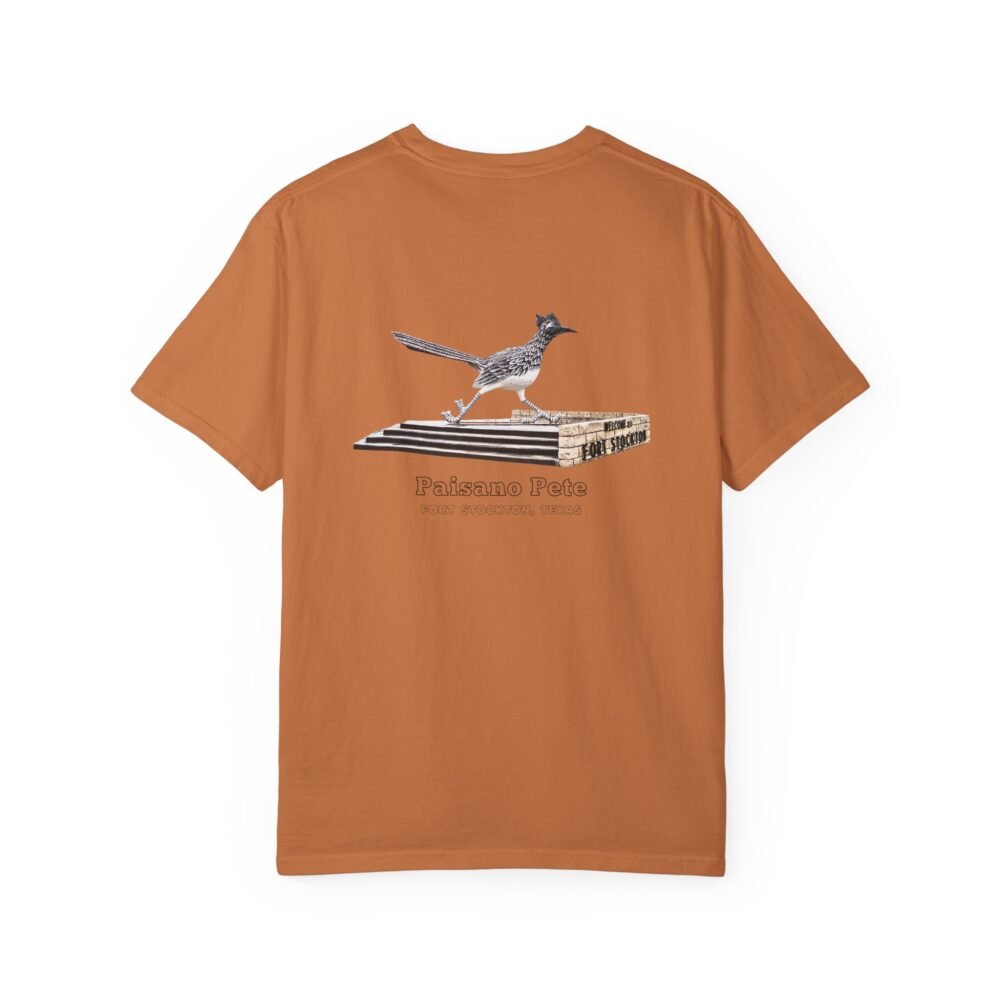 Orange-brown t-shirt featuring a graphic of Paisano Pete, the large roadrunner statue, standing on a white and gray base. Text below the graphic reads "Paisano Pete" and "FORT STOCKTON, TEXAS."