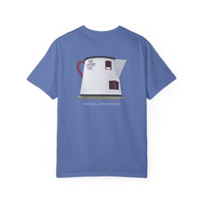 Blue t-shirt featuring a graphic of The Coffee Pot building in Bedford, Pennsylvania, a unique roadside attraction with a red handle and windows. The text "THE COFFEE POT" and "BEDFORD, PENNSYLVANIA" are visible.