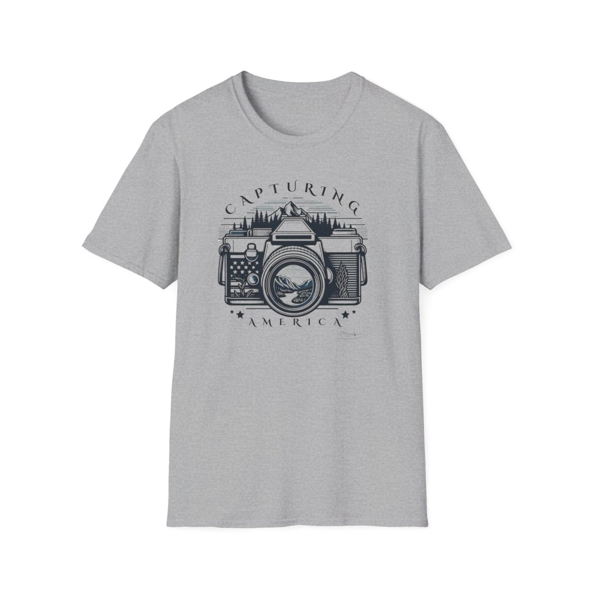 Light gray t-shirt with a vintage camera graphic, lens showing mountain landscape, and text "CAPTURING AMERICA".