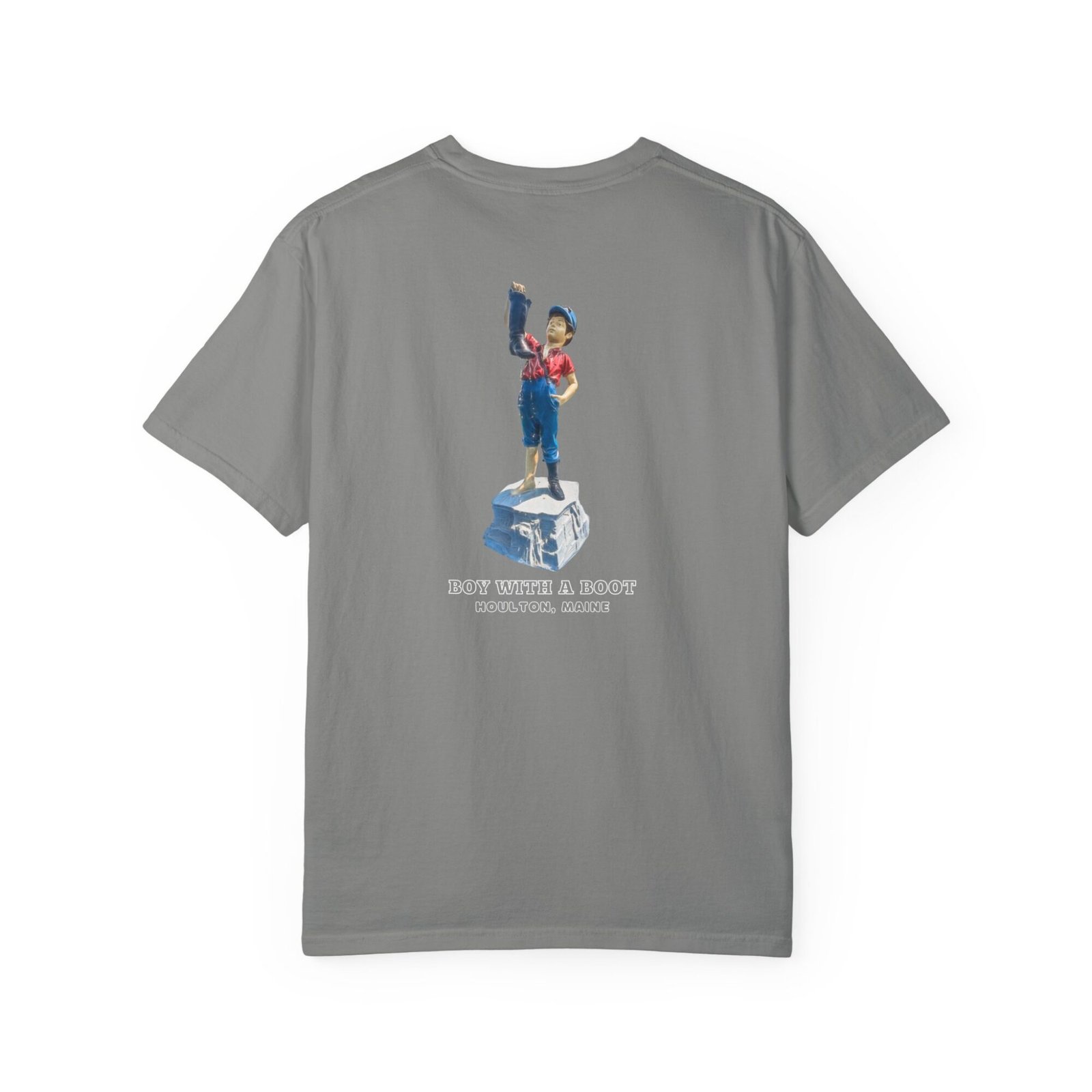 A dark t-shirt shows a graphic of the "Boy With A Boot" fountain statue from Houlton, Maine, depicting a young boy pouring water from a boot.