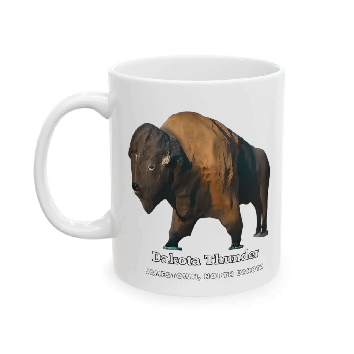 A white ceramic coffee mug with a graphic of "Dakota Thunder," a large brown bison statue, and text that reads "DAKOTA THUNDER JAMESTOWN, NORTH DAKOTA."