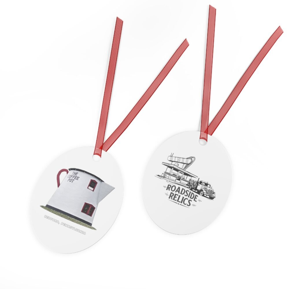 Round metal ornament with red ribbon, featuring the Giant Coffee Pot landmark on one side and a "Roadside Relics" diner and truck design on the other.