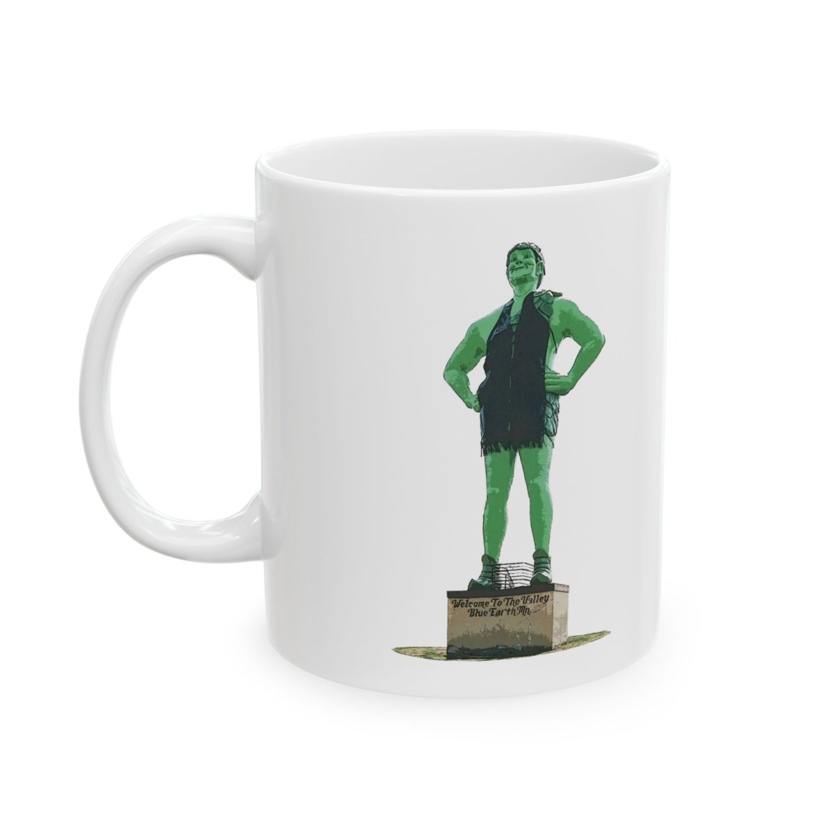 White ceramic coffee mug featuring the Jolly Green Giant statue with "Welcome To The Valley Blue Earth MN" text.