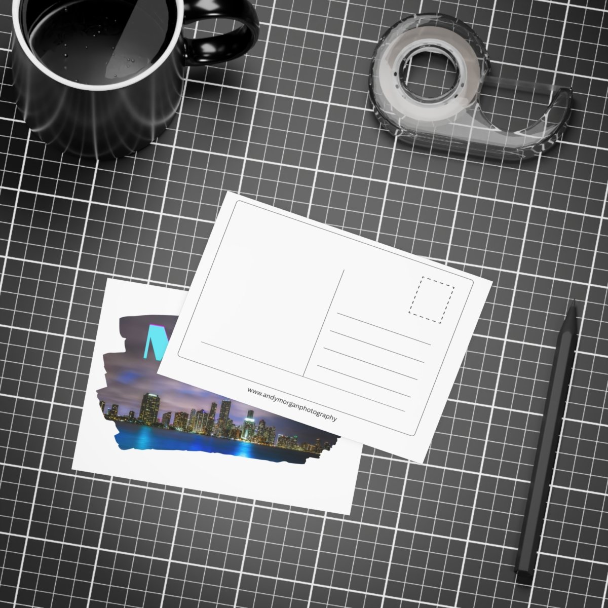 Stack of postcards with a Miami skyline at night, featuring the word "MIAMI" in stylized blue and purple text.