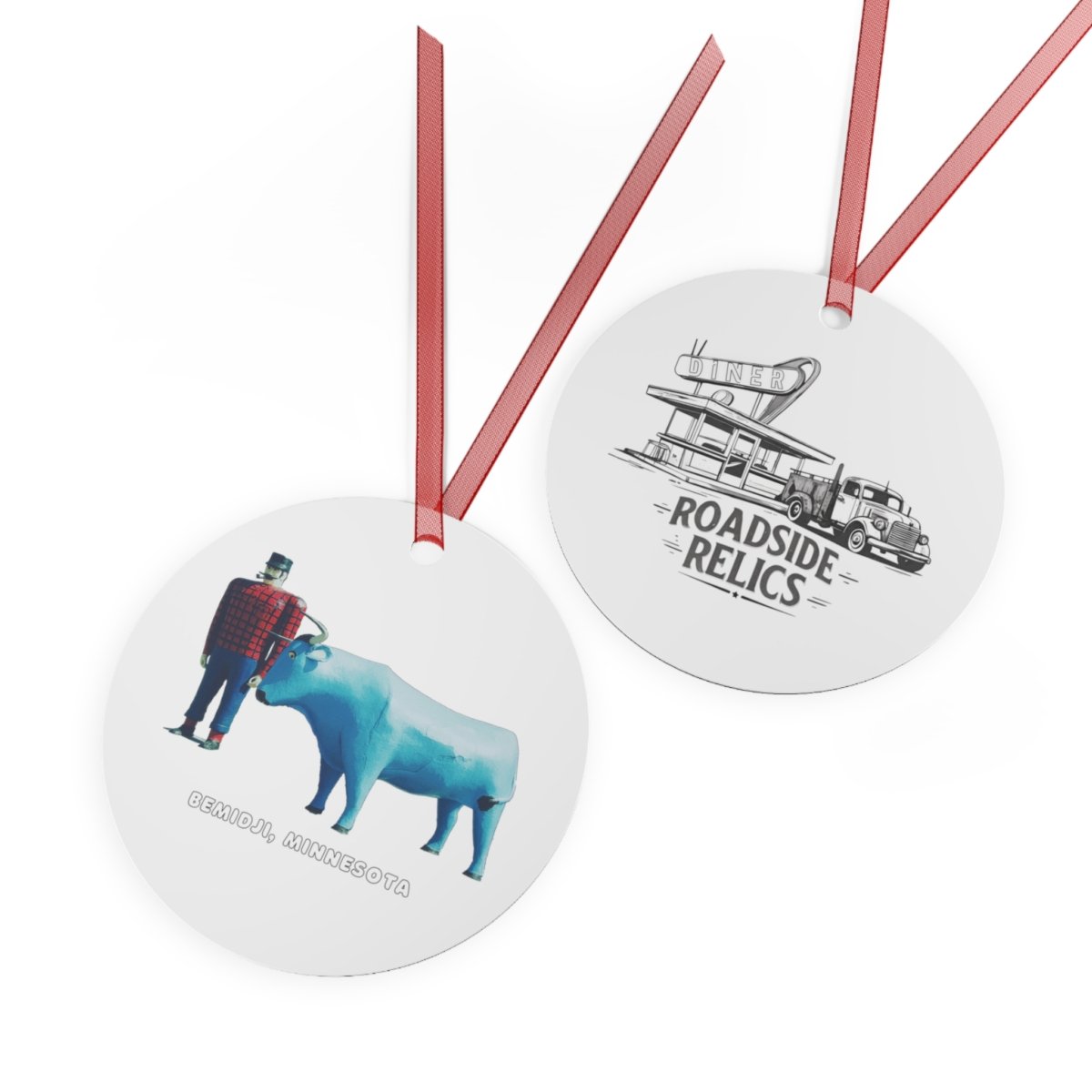 Round metal ornament with red ribbon, featuring Paul Bunyan and Babe the Blue Ox on one side and a "Roadside Relics" diner and truck design on the other.
