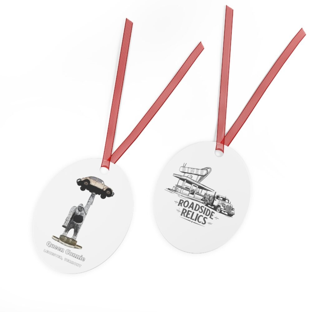 Oval metal ornament with red ribbon, featuring Queen Connie the gorilla statue holding a Volkswagen Beetle on one side and a "Roadside Relics" diner and truck design on the other.