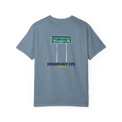 A light blue t-shirt with a graphic on the back featuring the Extraterrestrial Highway road sign and the text "HIGHWAY 375 Nevada."