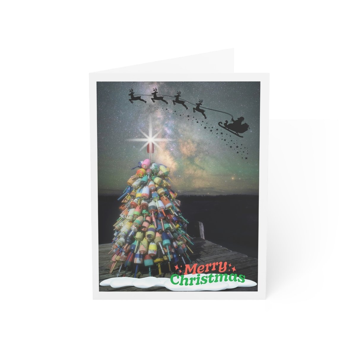 Christmas notecard featuring a Maine lobster buoy tree decorated with a star, set on a dark dock under a starry night sky with Santa's sleigh silhouette. Green text reads "Merry Christmas."