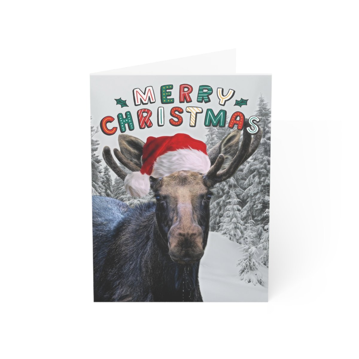 Funny Christmas notecard featuring a close-up photograph of a Maine moose wearing a red Santa hat, standing in a snowy forest with colorful "Merry Christmas" text.